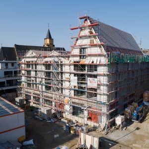 Baustelle von neuem Mehrfamilienhaus in Porz Mitte